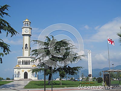 Clock tower and national flag of Georgia on the seafront in Batumi, Black Sea beach