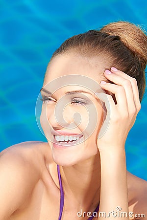 Close up of adorable woman in swimming pool