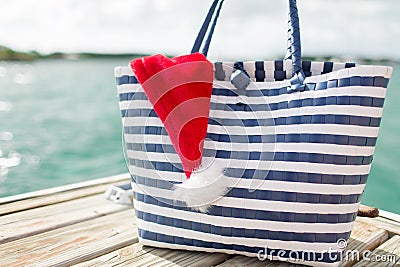 Close up of beach bag and santa helper hat