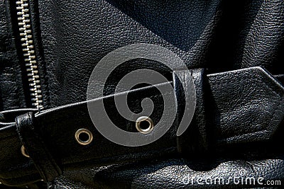 Close up of black leather biker jacket belt