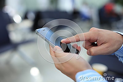 Close up of a business man using mobile