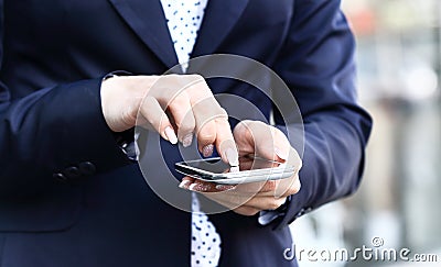 Close up of a business woman using mobile