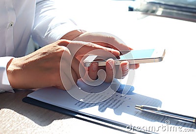 Close up of a business woman using mobile