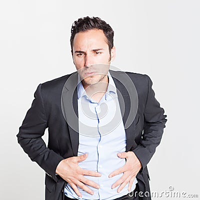 Close-up of businessman with strong stomach pain