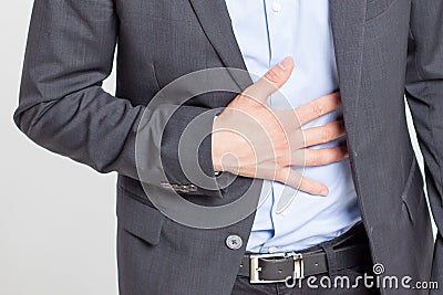 Close-up of businessman with strong stomach pain