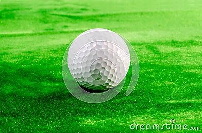 Close up of a golf ball on the green