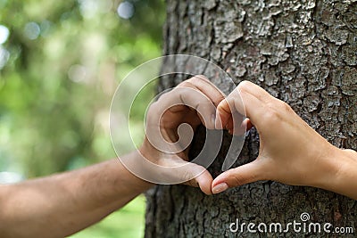 Close-up of human hands making heart shape in front