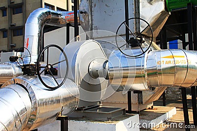 Close up of a industrial hot air pipe connected to