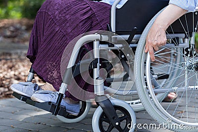 Close-up of legs of a disabled woman