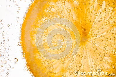 Close-up of lemon slice in clear water