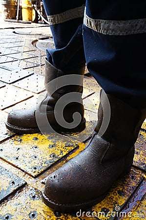 Close Up of Man Legs Standing on The Rig Floor