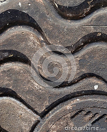 Close-up of the metal manhole cover in the sunshine.