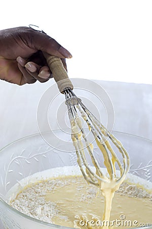 Close-up mixed yolk eggs, flour and sugar prepared for baking