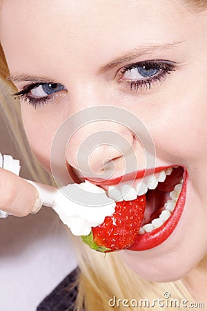 Close-up mouth and white teeth and strawberry