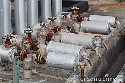 Close-up of old steam trap valve on pipe connection