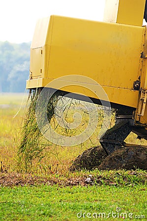 Close up of paddy harvest machine from back