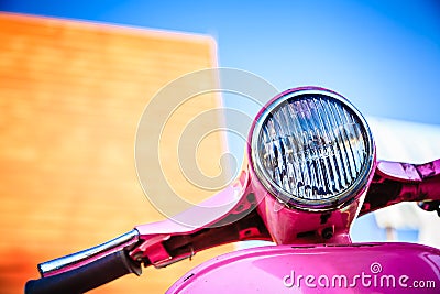 Close-up pink retro motorcycle