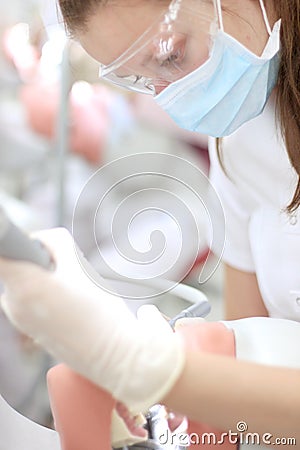Close-up portrait of dental student practicing with phantom head