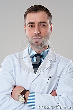 Close-up portrait of doctor with crossed arms