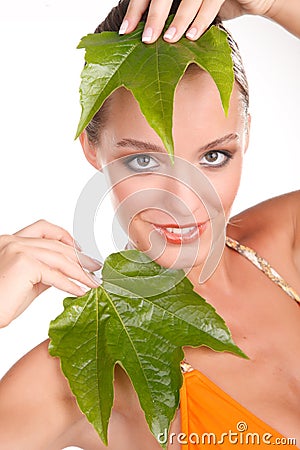 Close up portrait of a sexy blonde woman with leaf