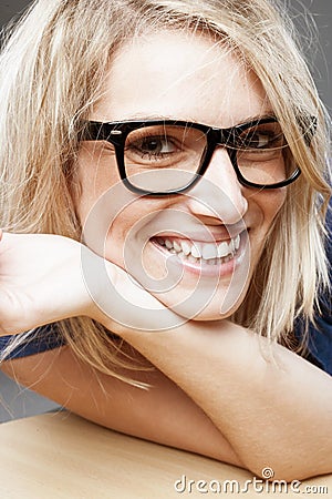 Close-up portrait of a smiling blond woman