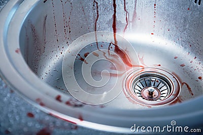 Close-up shot of bloody kitchen sink