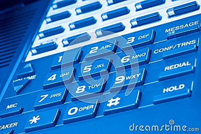 Close up of telephone keypad with blue hue