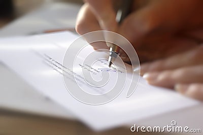Close up on a woman hands signing a contract