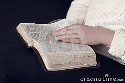 Close up of a woman reading the Bible