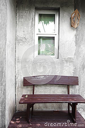 Close up wooden chair and wall