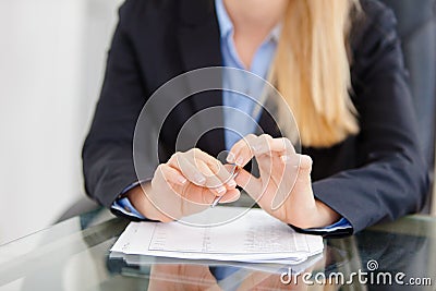 Close-up of working businesswoman at the desk