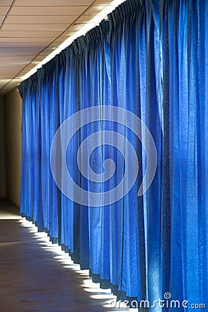 Close view of a blue curtain.