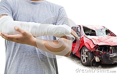 Closeup of bandaged arm with blue wrecked car