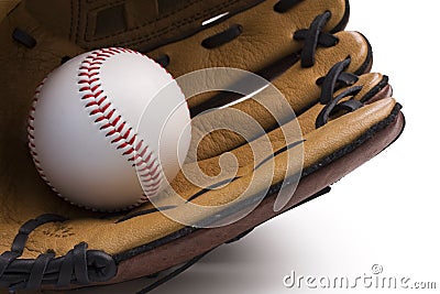 Closeup of baseball glove holding baseball