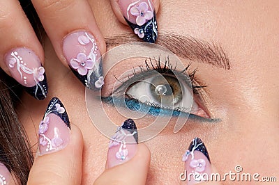 Closeup eyes make-up zone. Nail art