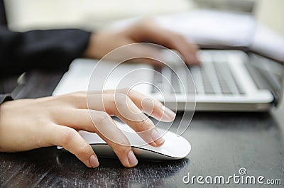 Closeup of hand on mouse