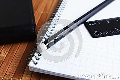 Pen, spiral notebook and ruler