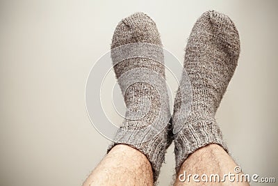 Closeup photo of feet and woolen socks