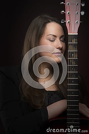 Beauty Woman With Guitar Portrait