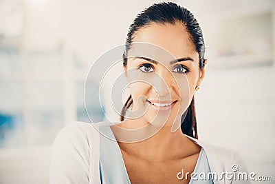 Closeup portrait of beautiful Indian woman smiling at camera