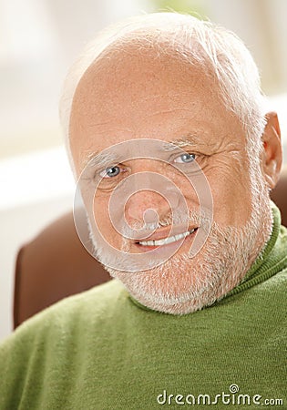 Closeup portrait of cheerful old man