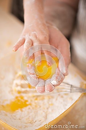 Closeup portrait of little child cooking egg