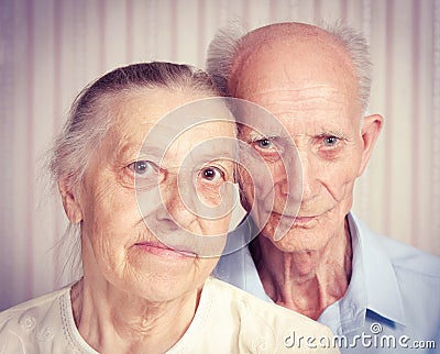 Closeup portrait of smiling elderly couple