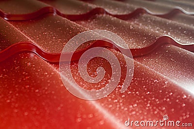 Closeup of red metal roof covering