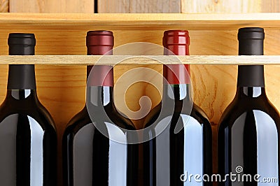 Closeup of Red Wine Bottles in Wooden Case