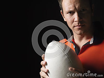 Closeup Of Rugby Player Holding Ball