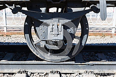 Closeup view of an old railway car wheels, leaf springs, journal