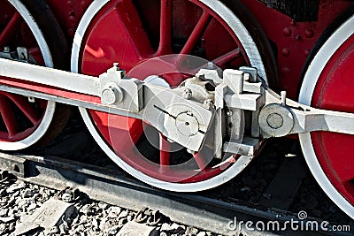 Closeup view of steam locomotive wheels, drives, rods, links and