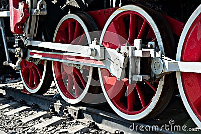 Closeup view of steam locomotive wheels, drives, rods, links and