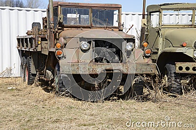 Closeup view of two old army vehicles